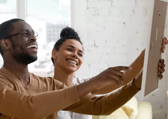 couple looking at new cabinet in home renovation project